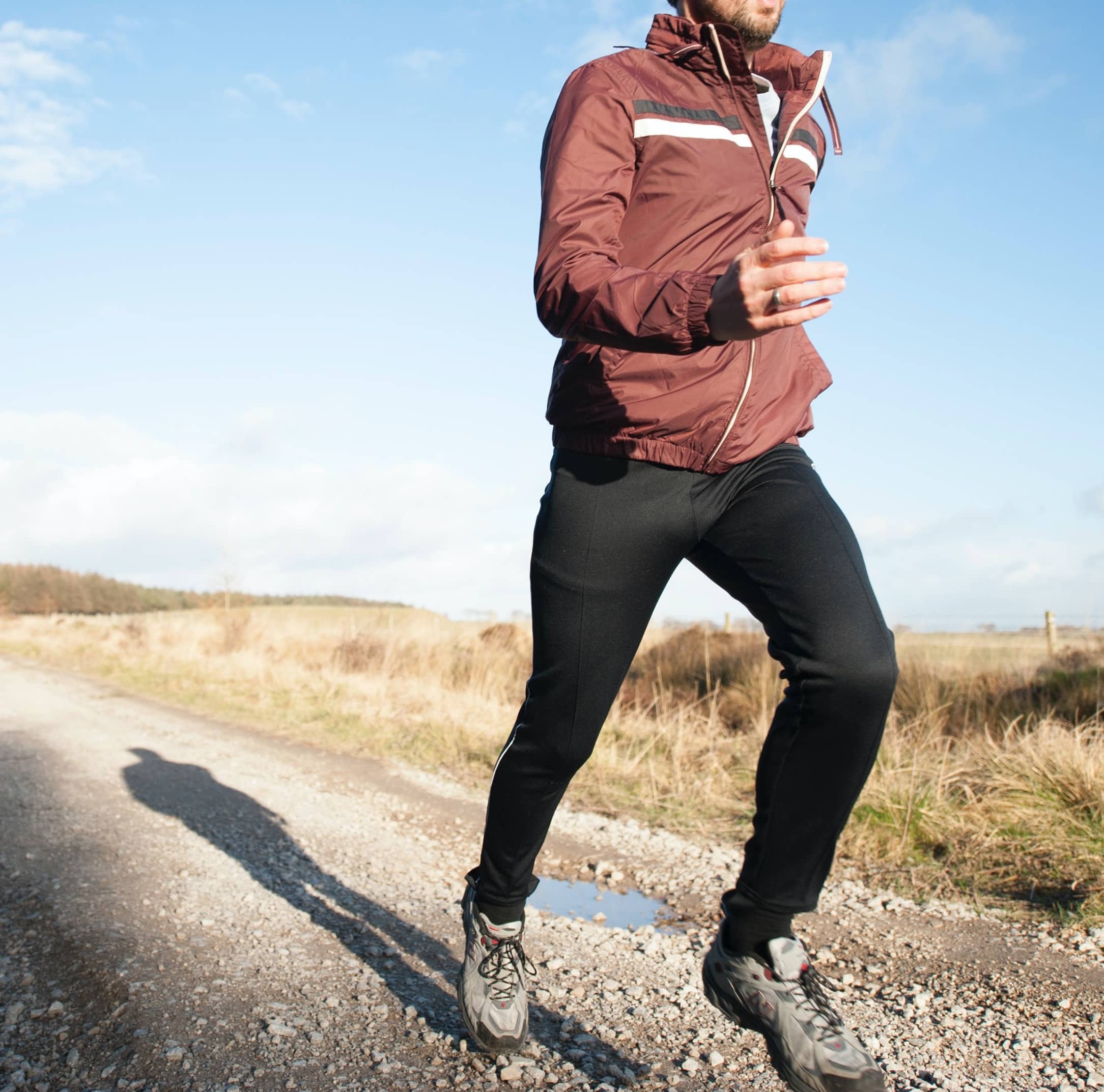 Man running on a path, using exercise as a way to improve male fertility