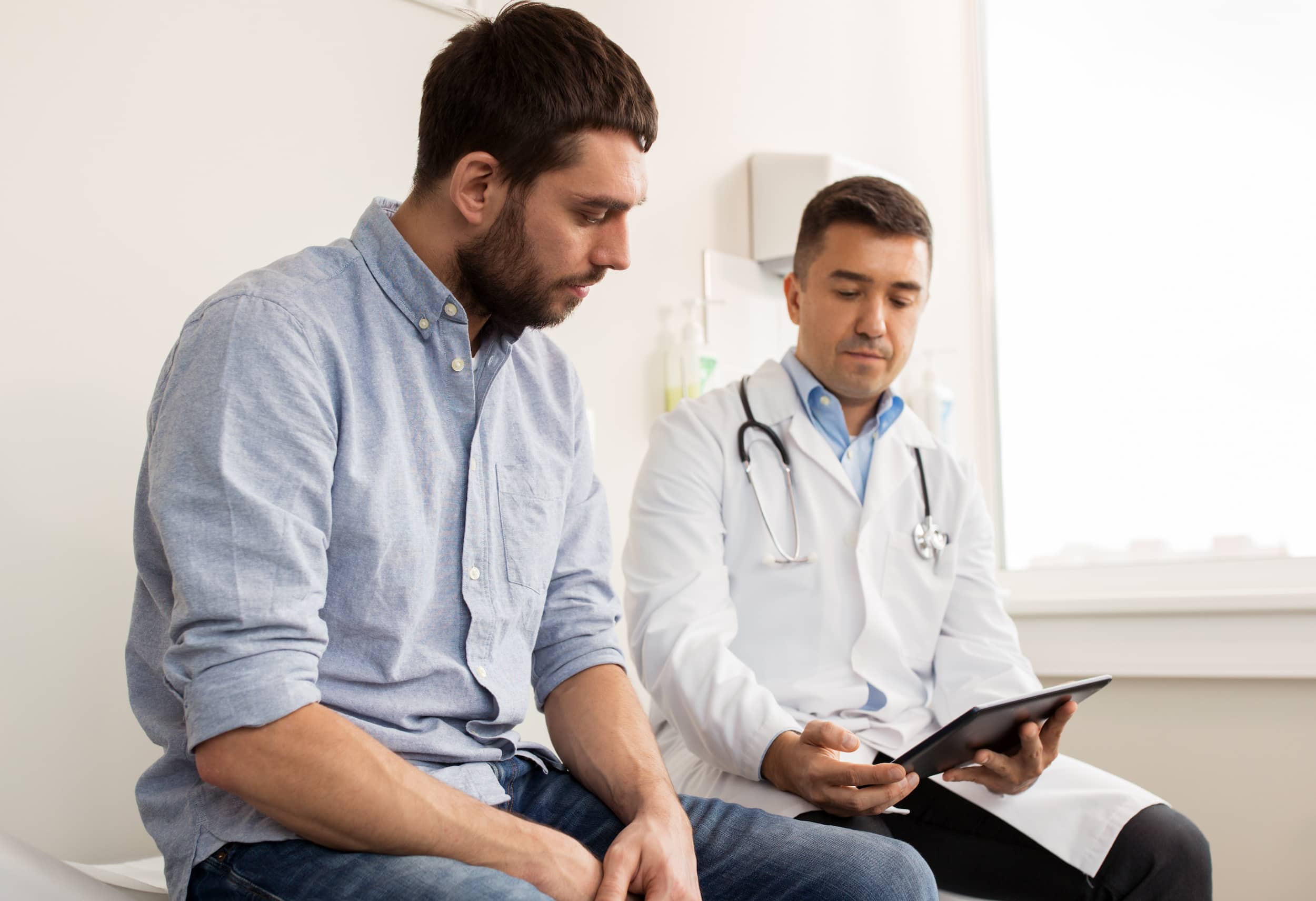 Man talking to a doctor about low testosterone