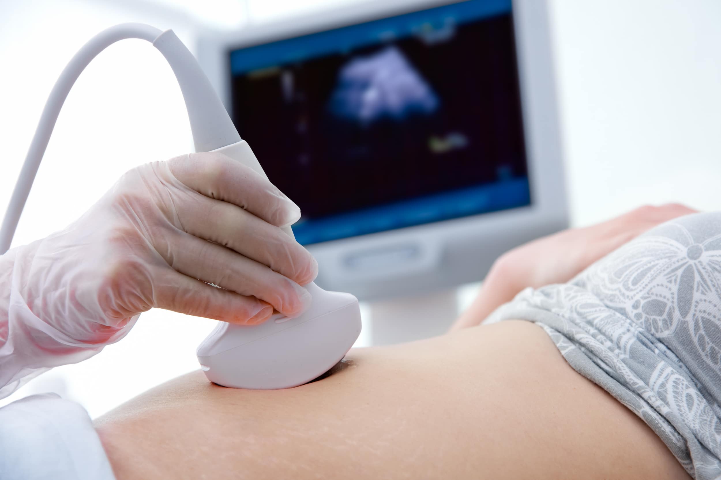 Female receiving an ultrasound, female fertility test