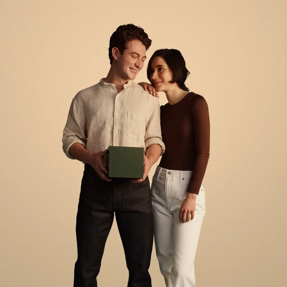 Couple with plain gold background