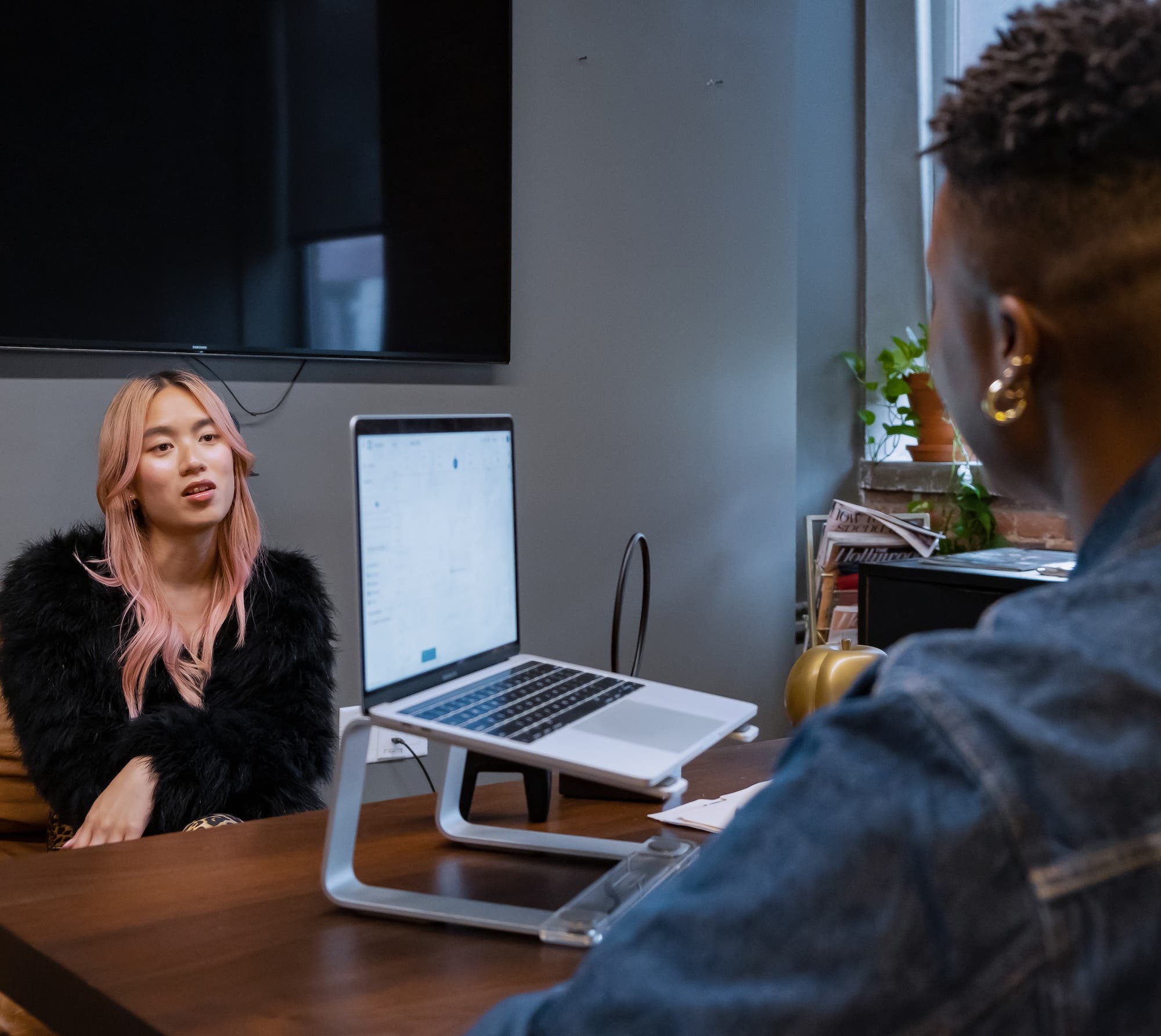 Physician speaking with transgender female patient