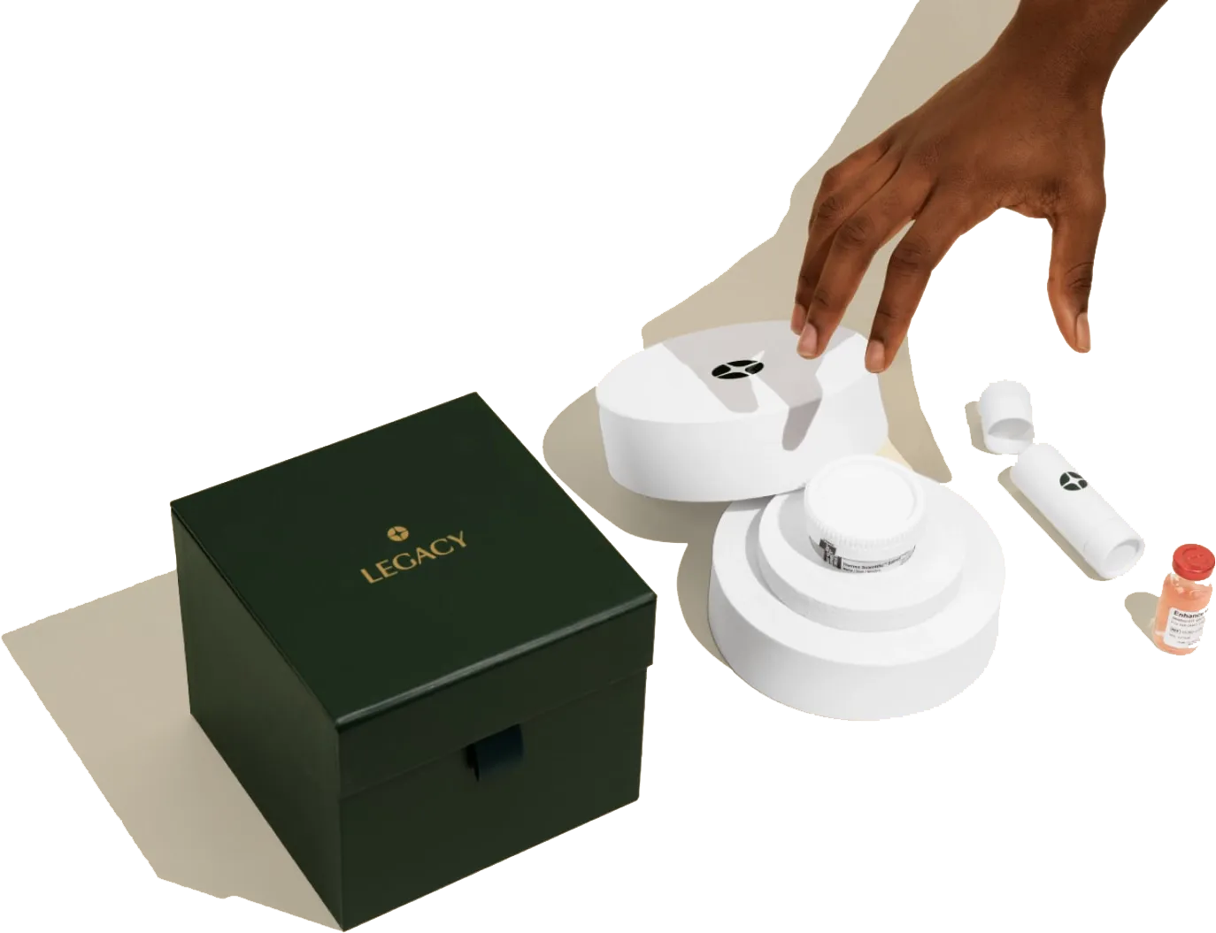 Hand reaching for a Legacy testing kit